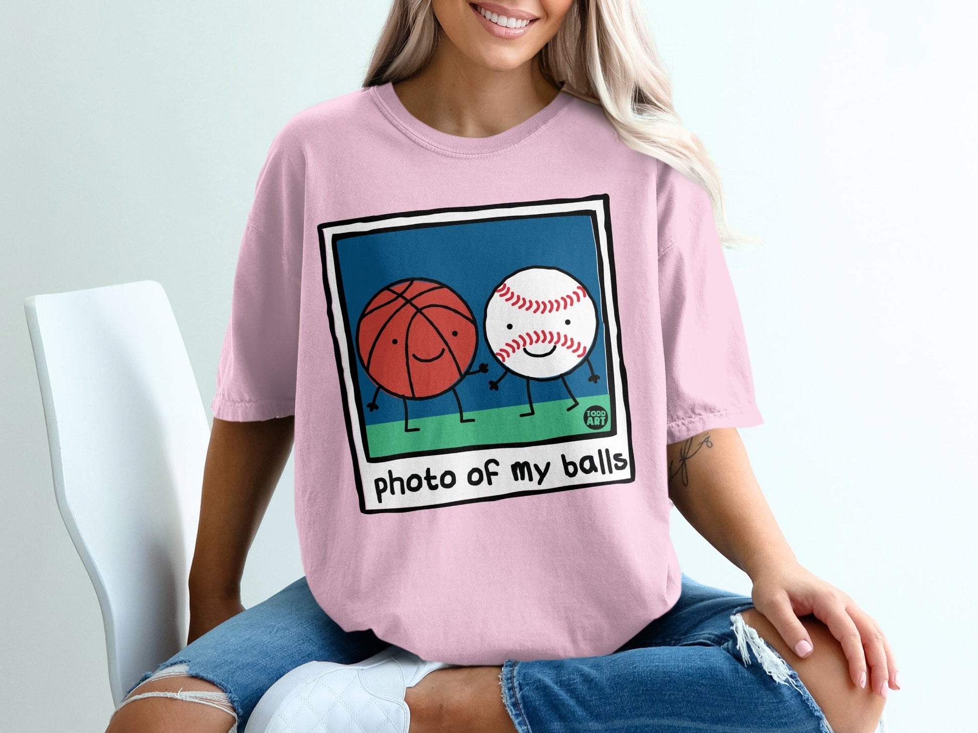 Cartoon basketball and baseball characters holding hands with text "photo of my balls".