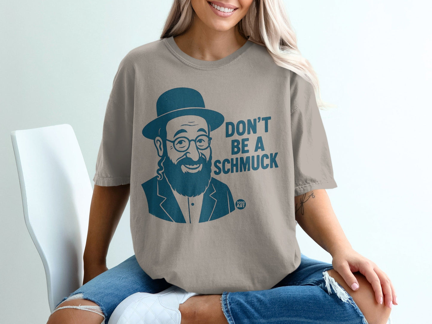 T-shirt with a man in a hat and text "DON'T BE A SCHMUCK".