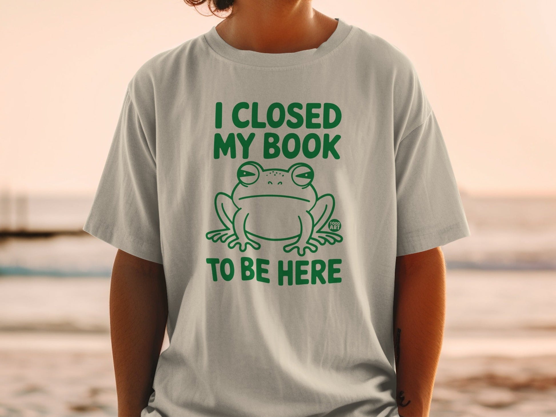 I Closed My Book To Be Here Frog Graphic T-shirt
