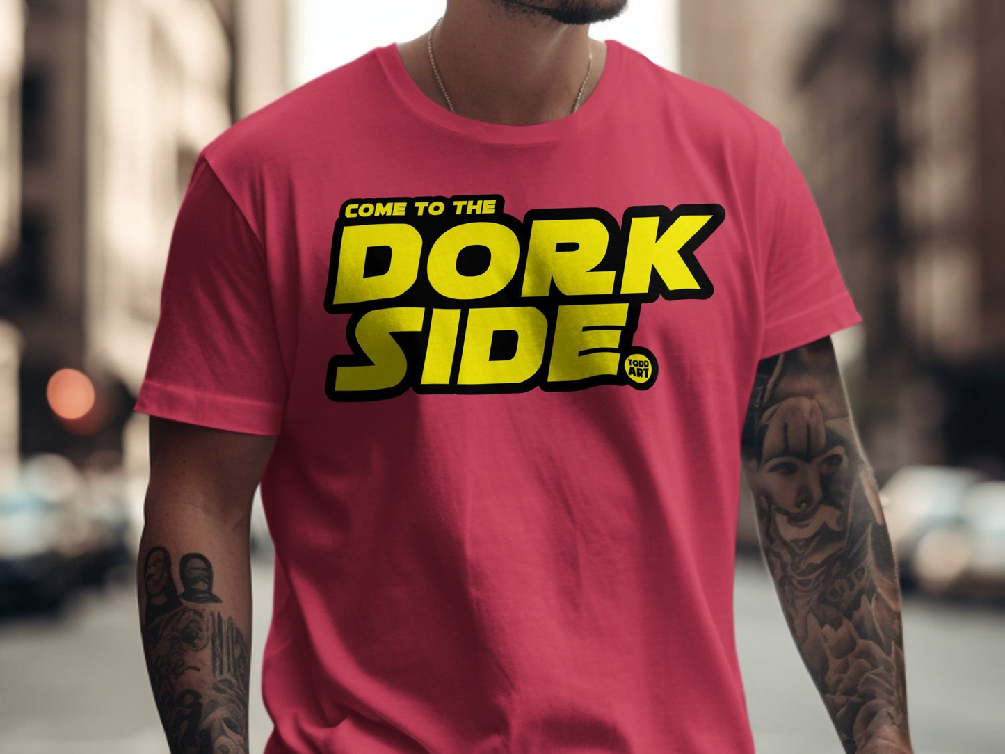 Red t-shirt with yellow "Dork Side" text and small "Geek Art" logo.