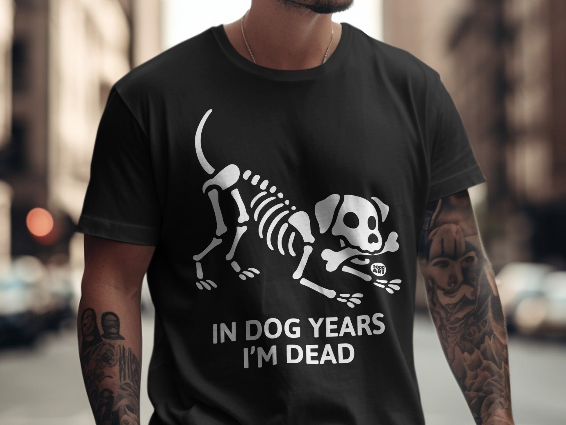 Black t-shirt with white skeleton dog graphic and "IN DOG YEARS I'M DEAD" text.