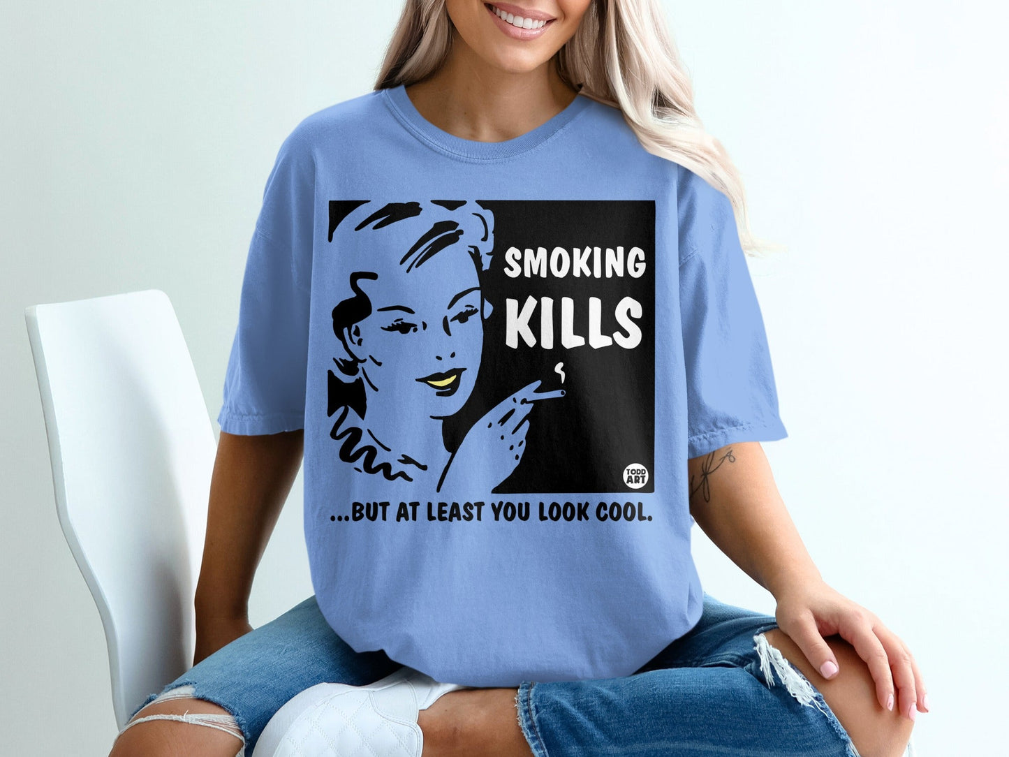 Blue t-shirt with "SMOKING KILLS ...BUT AT LEAST YOU LOOK COOL" text and illustration.