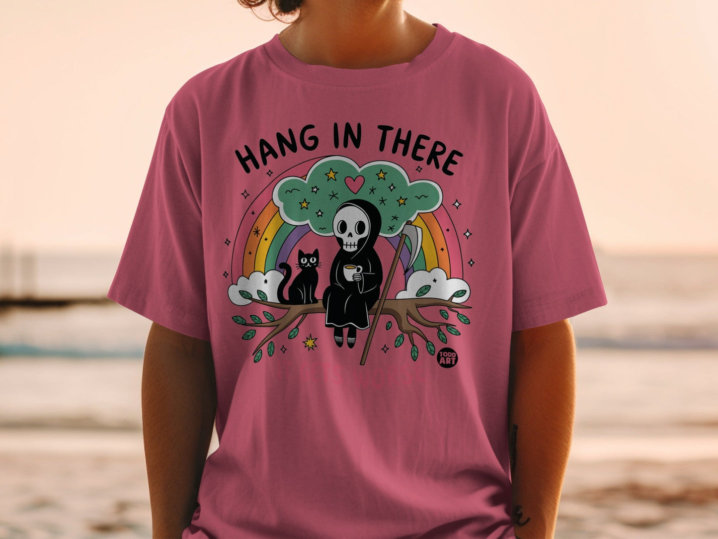 Grim reaper cat and rainbow design with text "Hang in There".