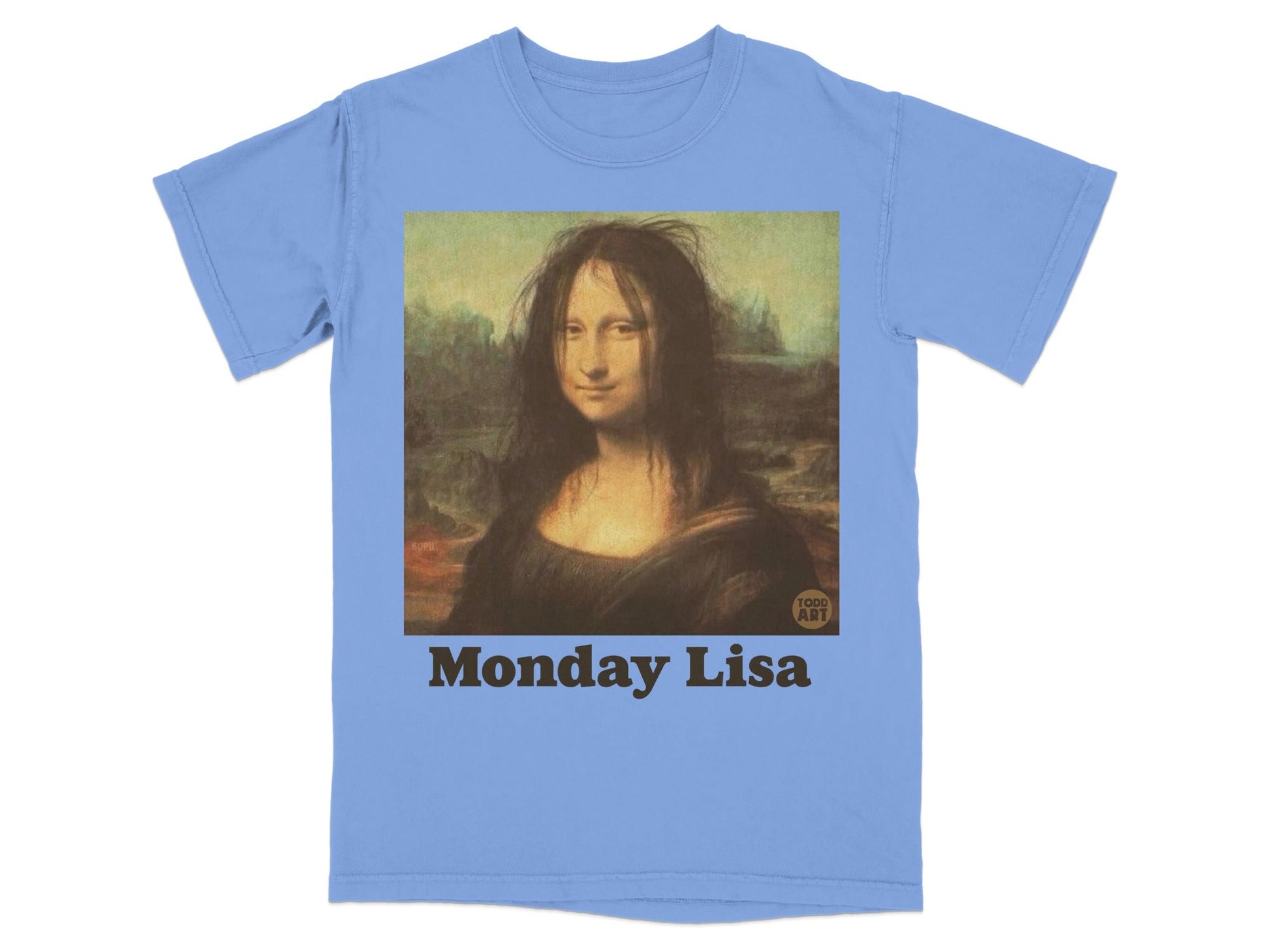 Blue t-shirt with a stylized Mona Lisa wearing messy hair, text "Monday Lisa".