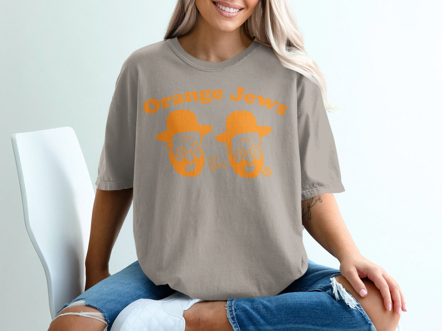 Grey t-shirt with "Orange Jews" text and cartoon faces.