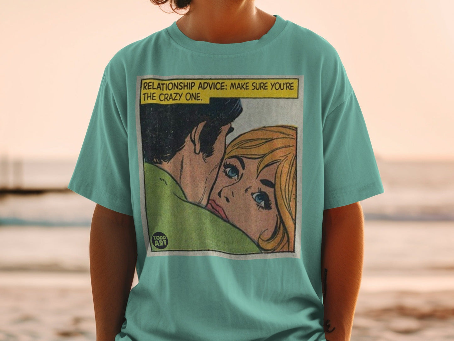 T-shirt featuring comic art of a couple with text "RELATIONSHIP ADVICE: MAKE SURE YOU'RE THE CRAZY ONE."