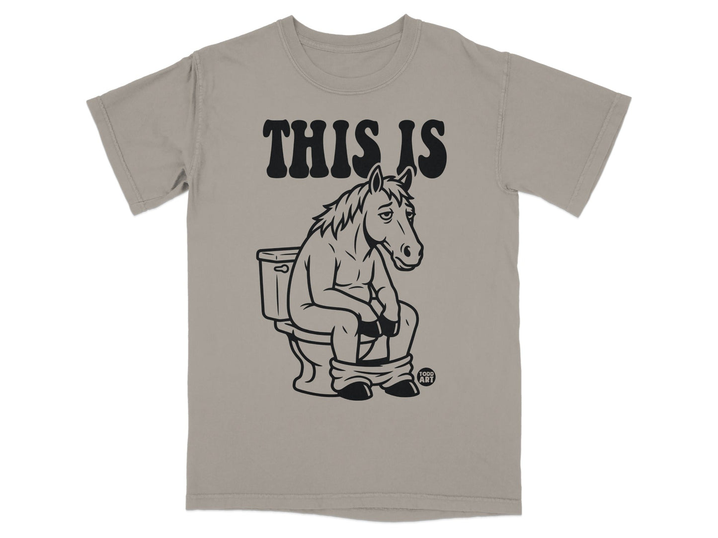 Graphic tee with horse sitting on a toilet and text THIS IS.