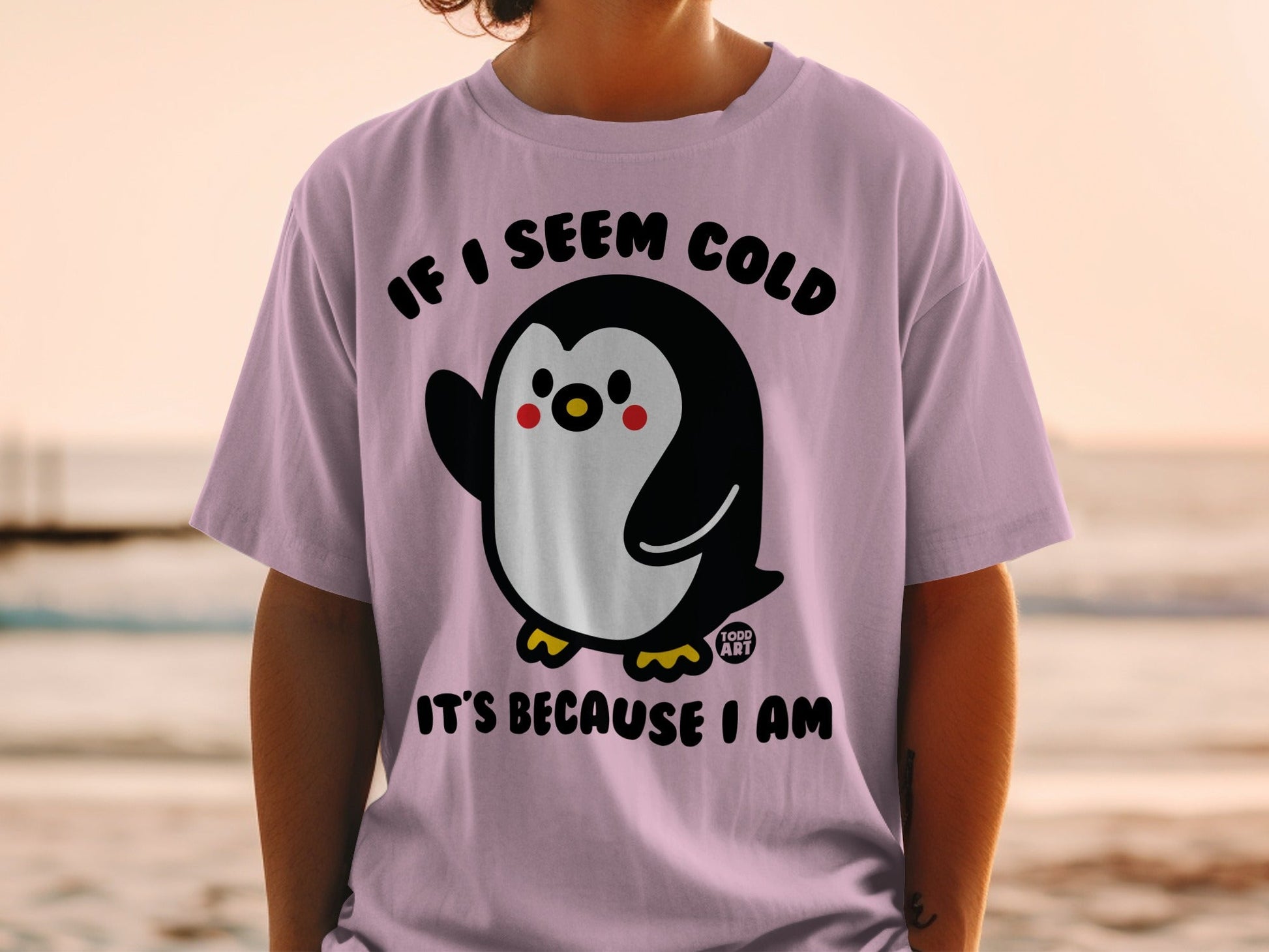 Penguin graphic t-shirt with text "IF I SEEM COLD IT'S BECAUSE I AM".