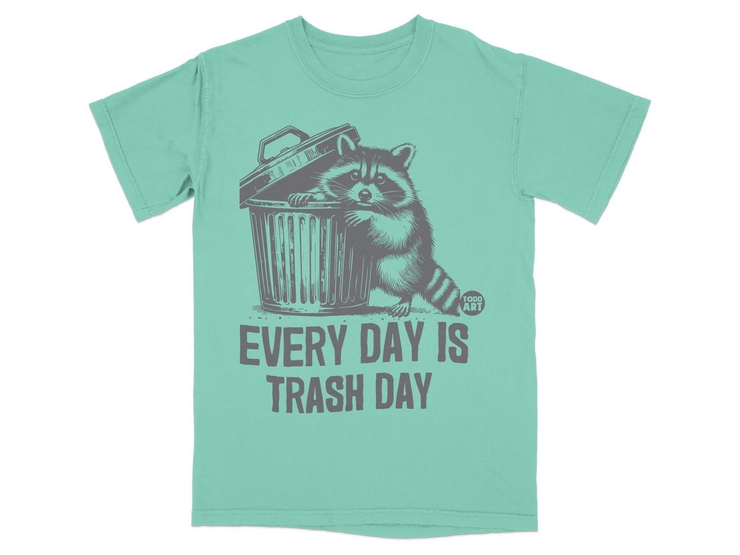 T-shirt with raccoon peeking out of trash can, "EVERY DAY IS TRASH DAY" text.