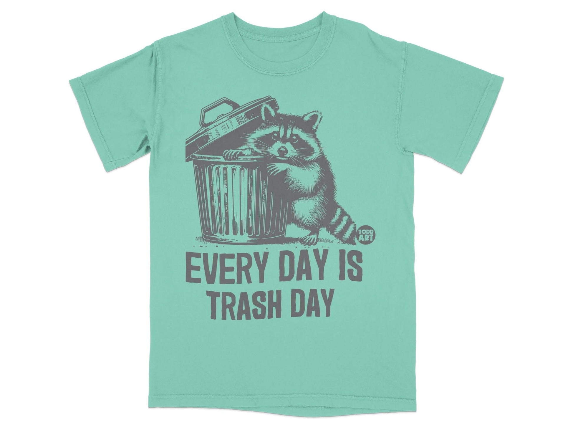T-shirt with raccoon peeking out of trash can, "EVERY DAY IS TRASH DAY" text.