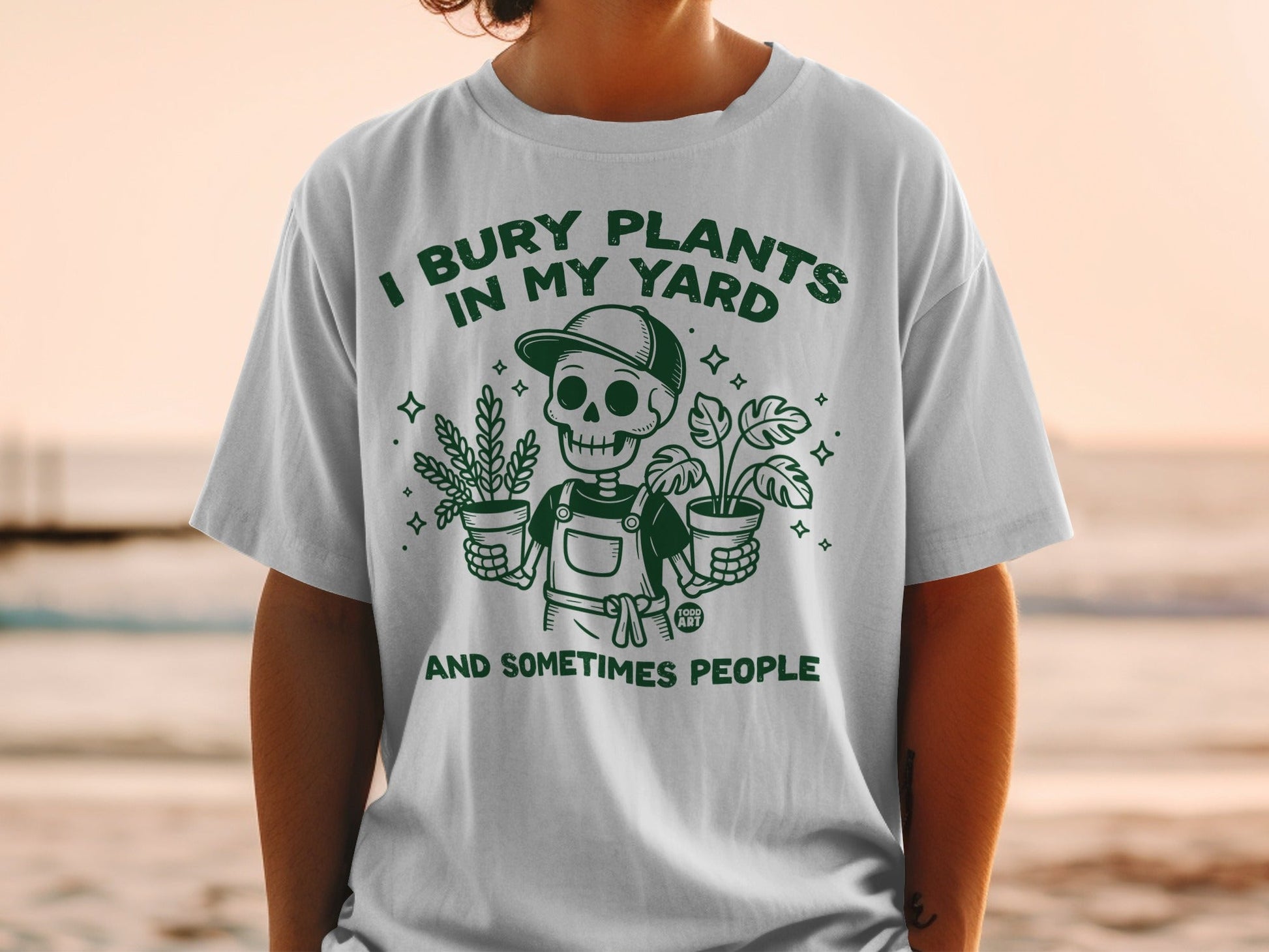 Skeleton holding potted plants with text "I bury plants in my yard and sometimes people."