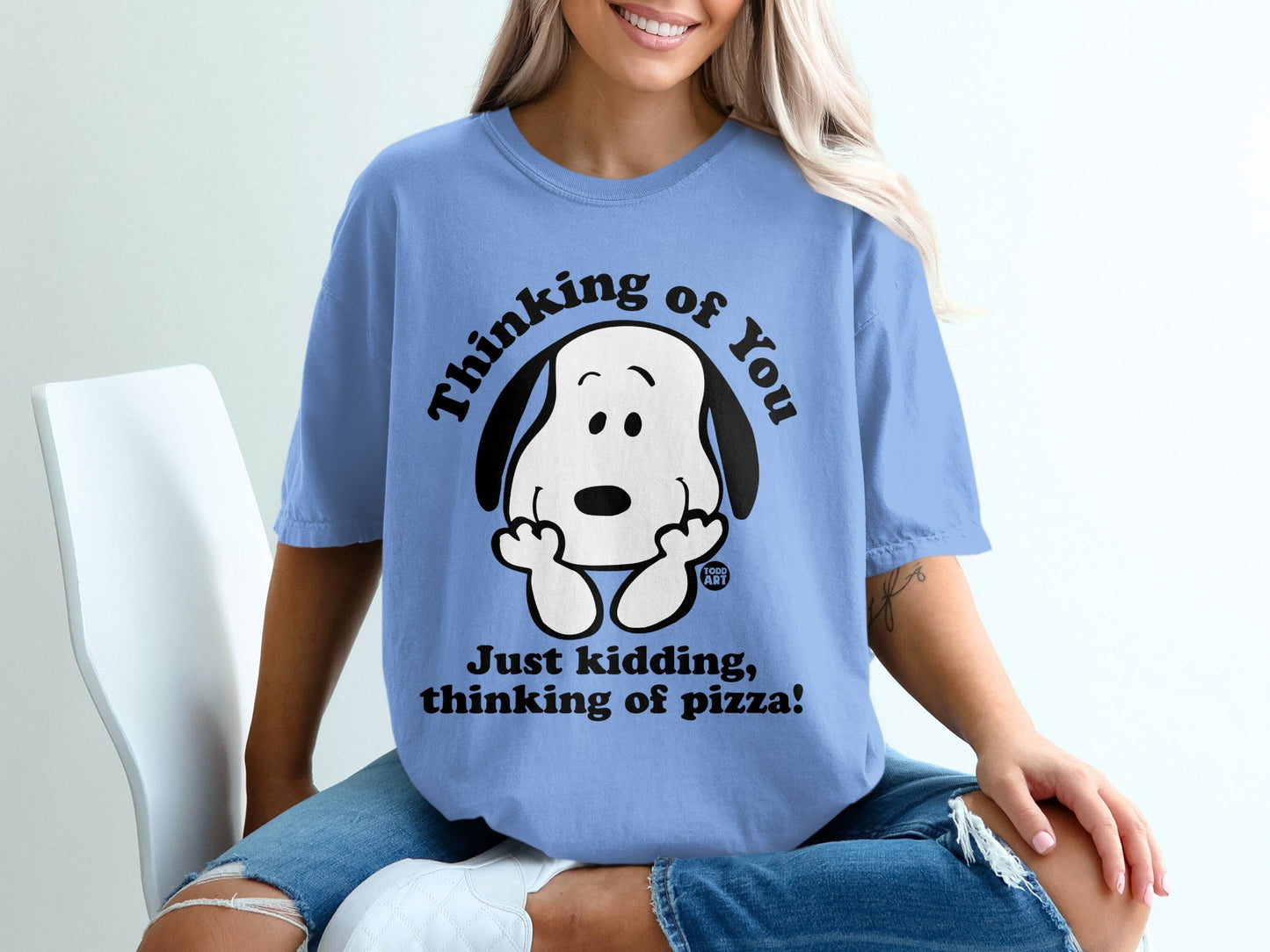 Blue t-shirt with Snoopy graphic saying "Thinking of pizza!"