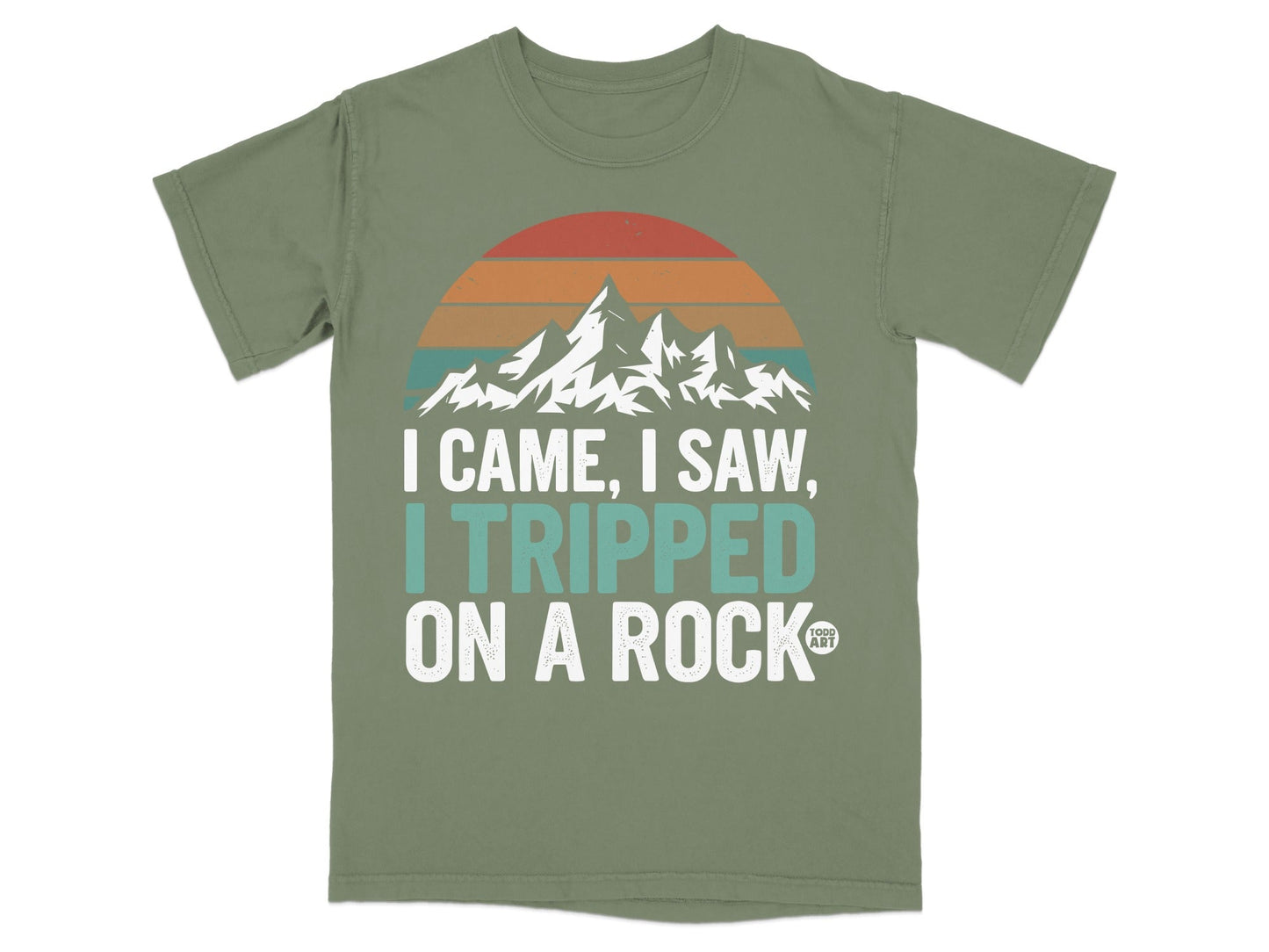 Olive green t-shirt with "I came, I saw, I tripped on a rock" text.