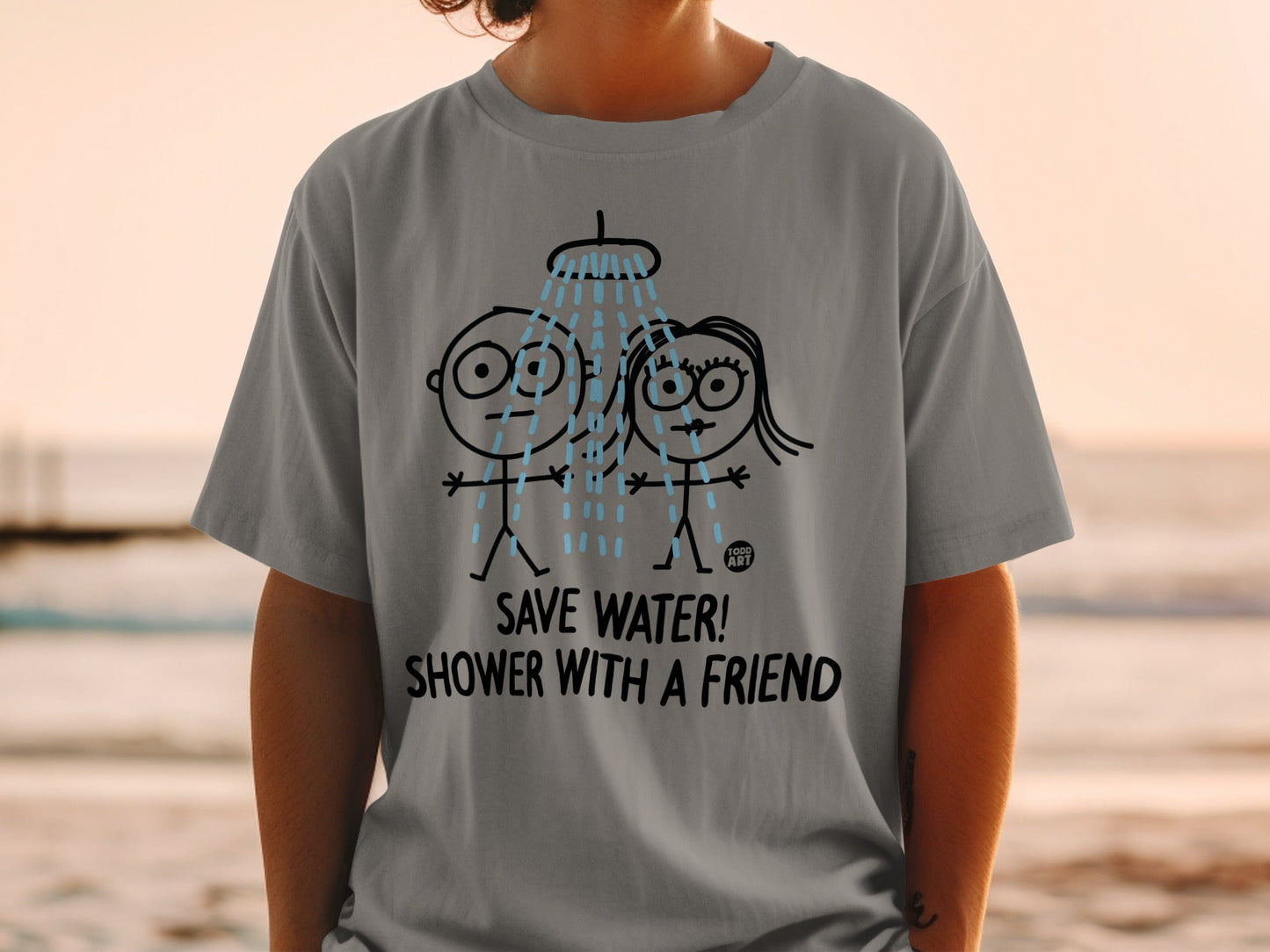 Grey t-shirt with cartoon couple showering under water spray.