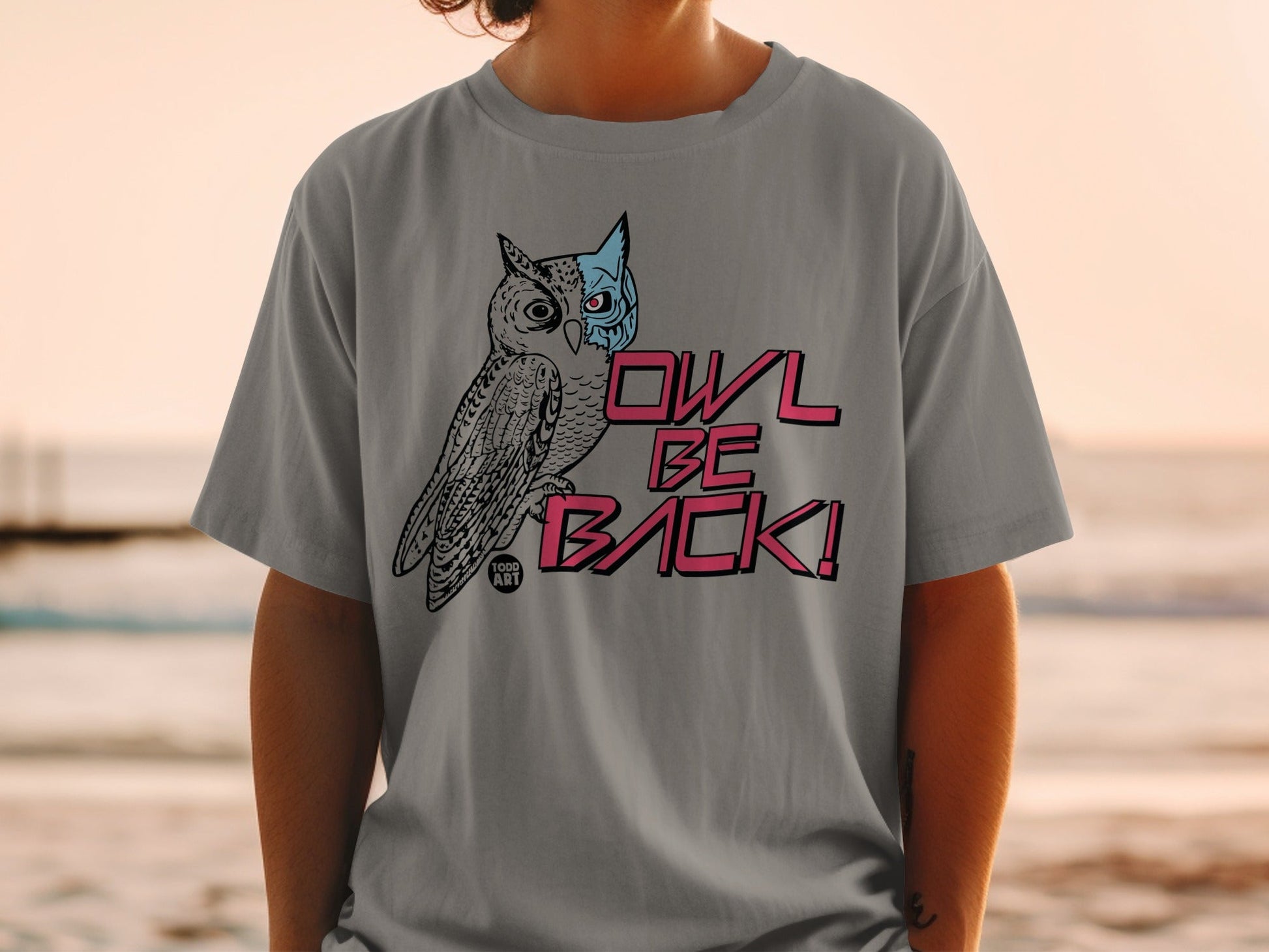 Grey t-shirt with "OWL BE BACK!" text and owl graphic.