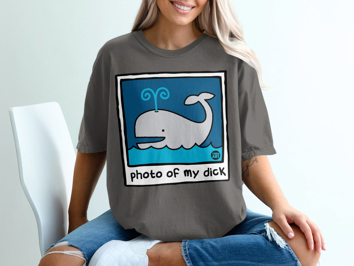 Graphic t-shirt with cartoon whale and "photo of my dick" text.