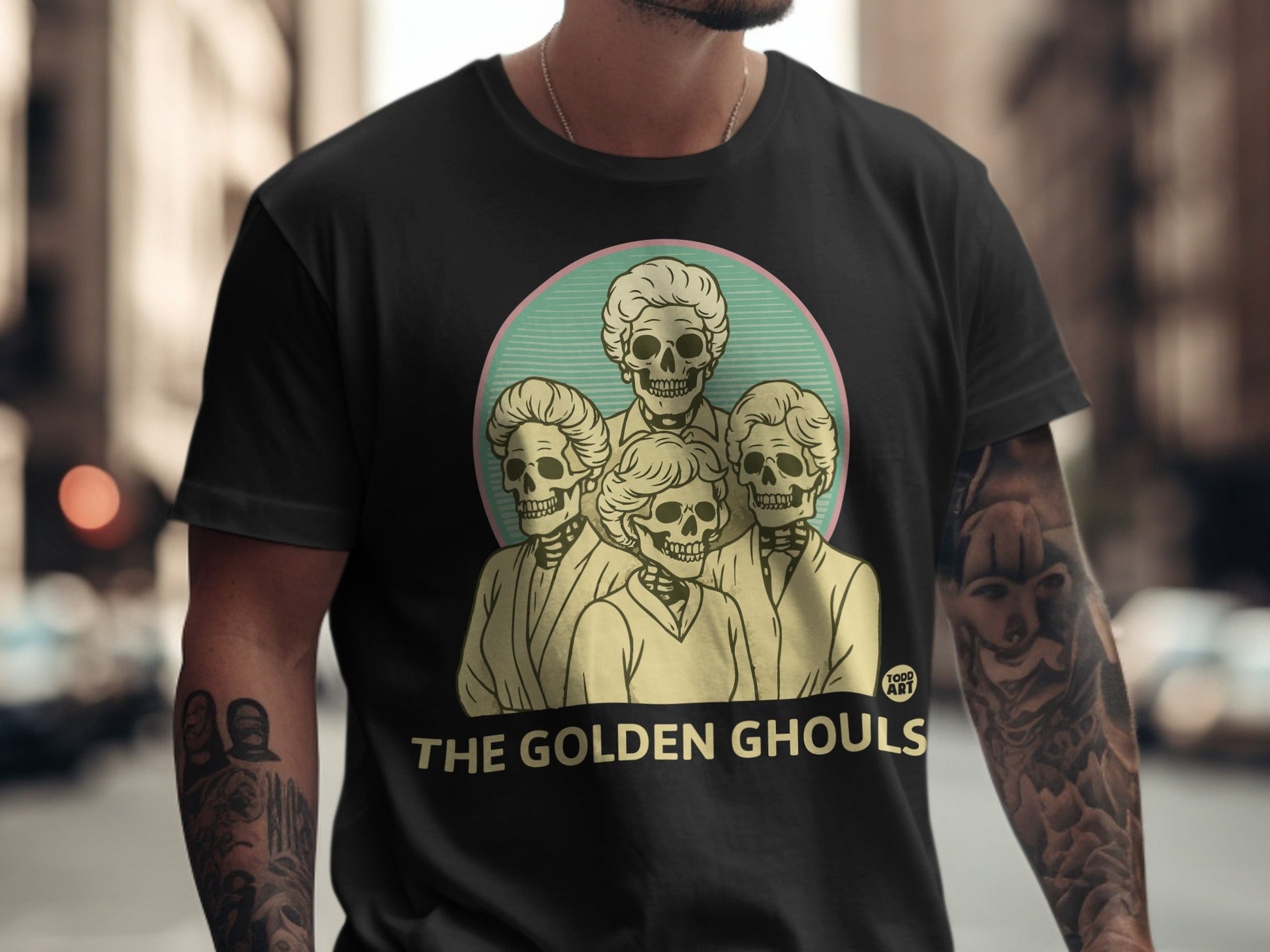 Black t-shirt featuring the Golden Ghouls in a circular illustration.