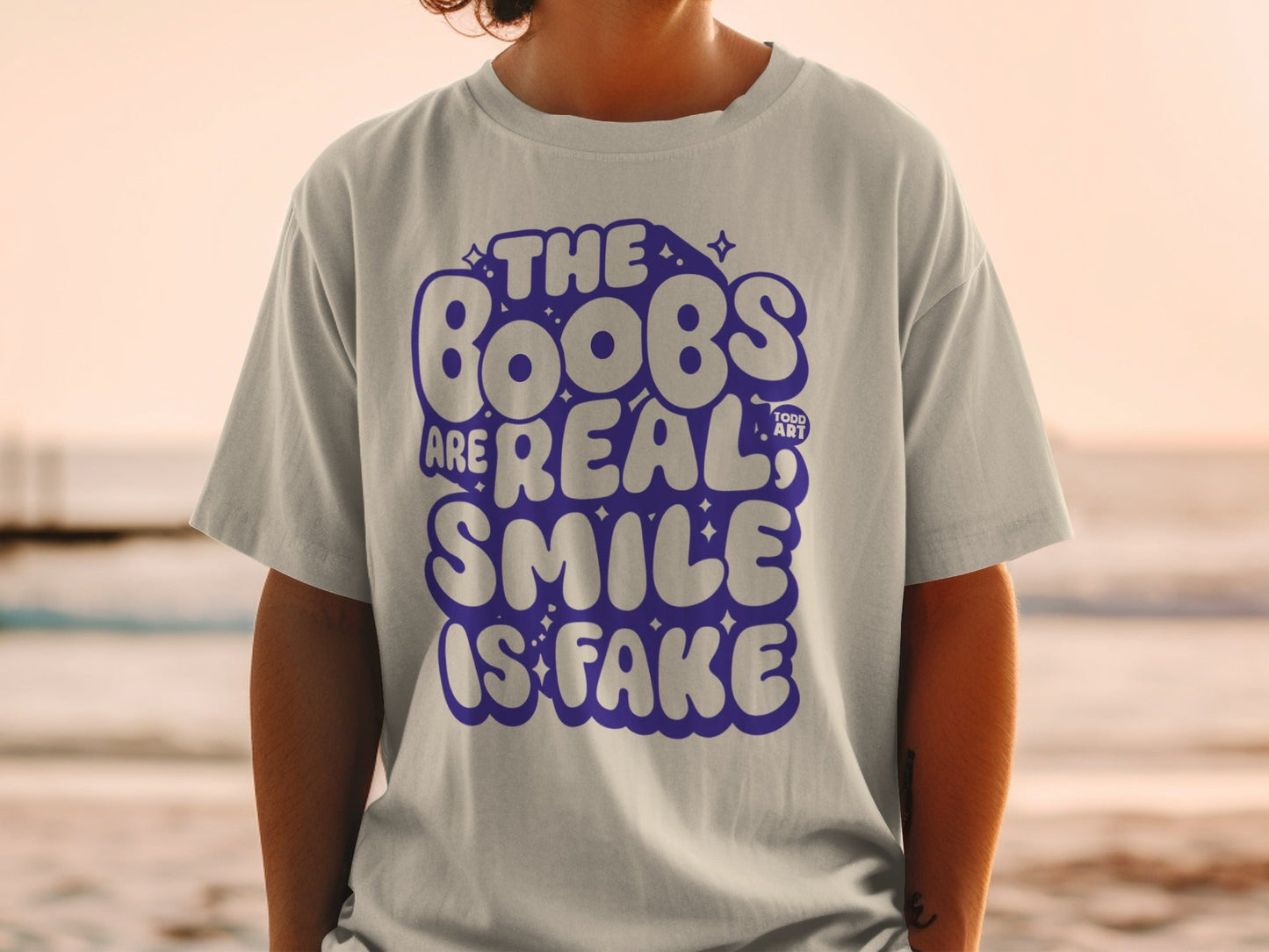 The Boobs Are Real Smile Is Fake Graphic Tee