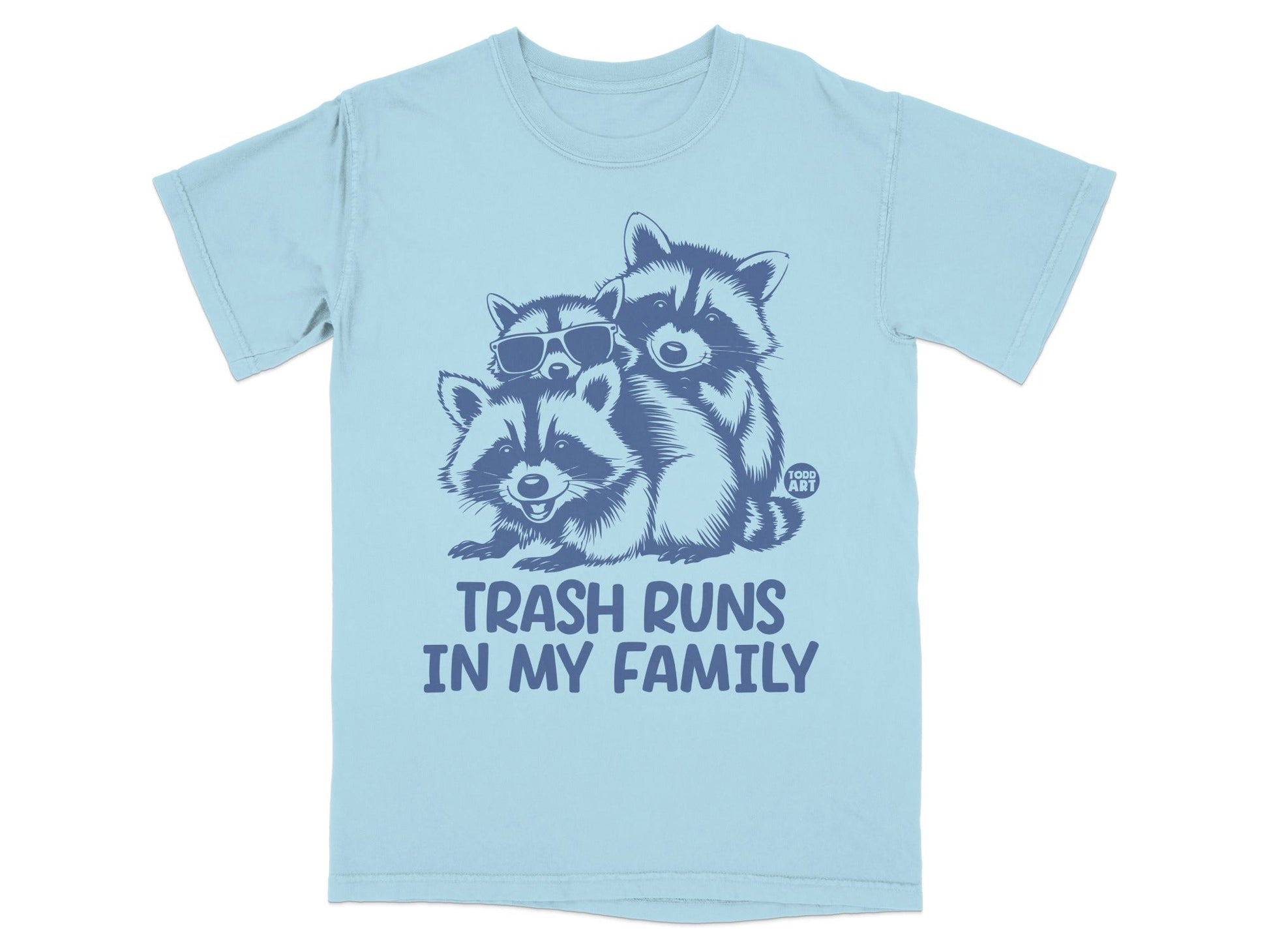 Light blue t-shirt with three raccoons and "TRASH RUNS IN MY FAMILY" text.