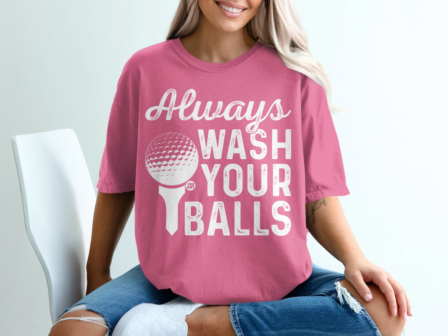 Pink t-shirt with "Always Wash Your Balls" text and golf ball graphic.