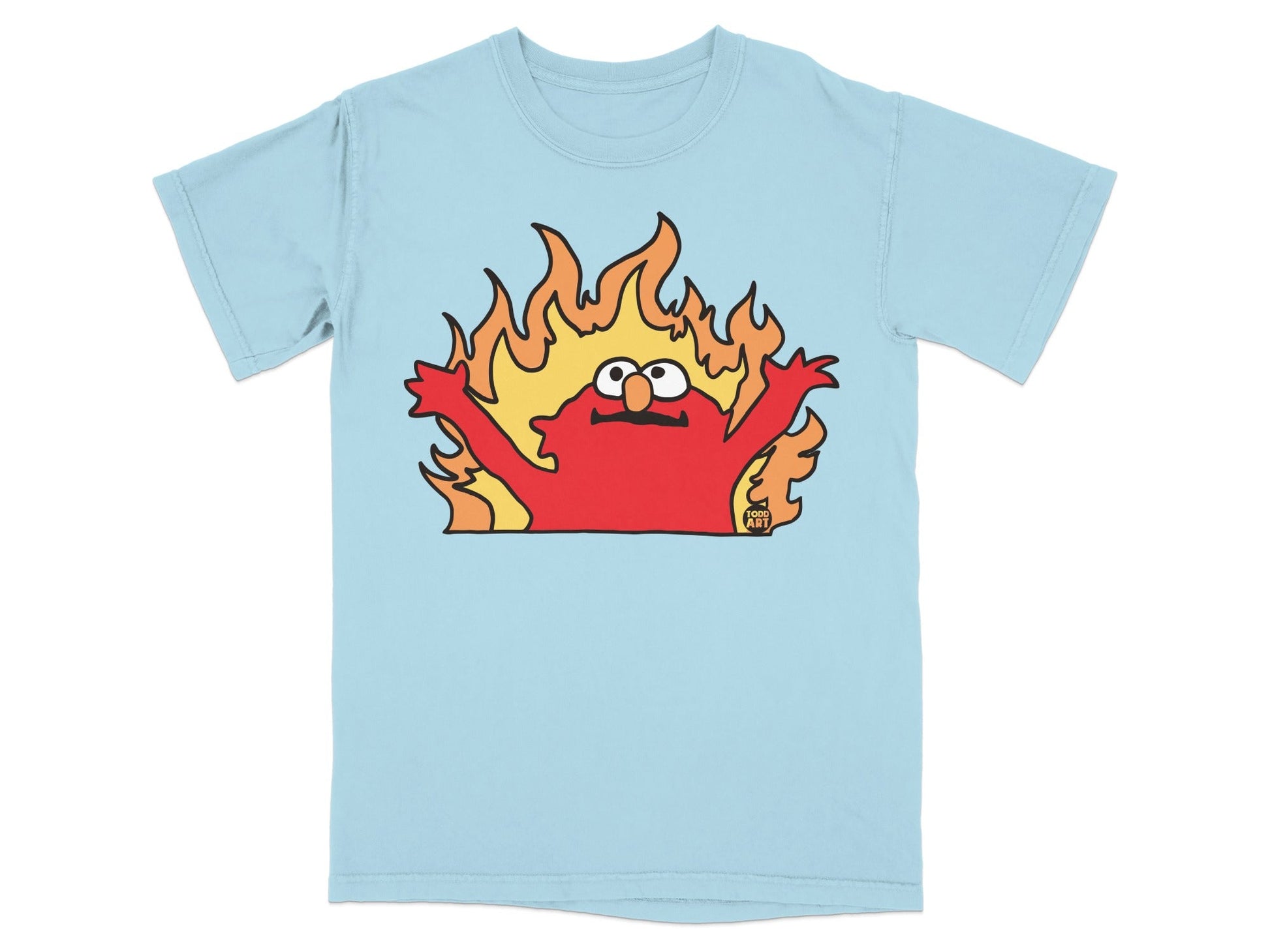 Elmo with arms raised on fire against a light blue t-shirt.