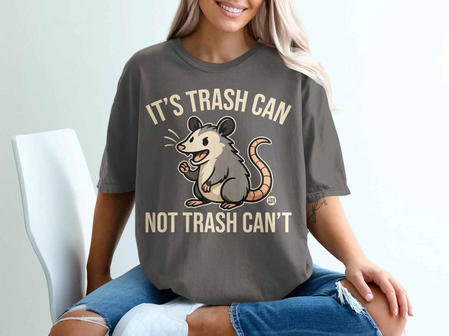 Dark grey t-shirt with possum and "It's trash can, not trash can't" text.