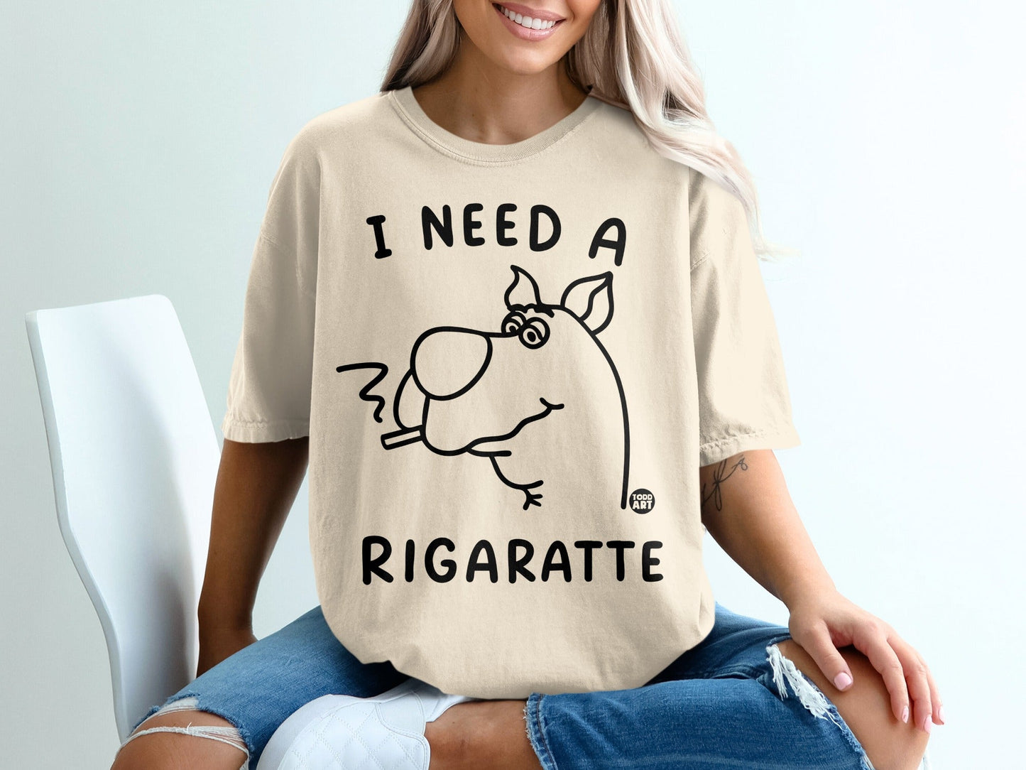 Cream t-shirt with Scooby-Doo graphic saying "I need a rigarette."