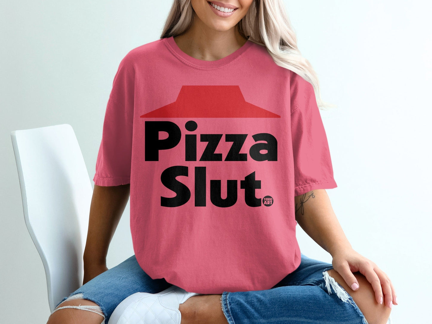 Pink t-shirt with "Pizza Slut" and "Food Art" text.