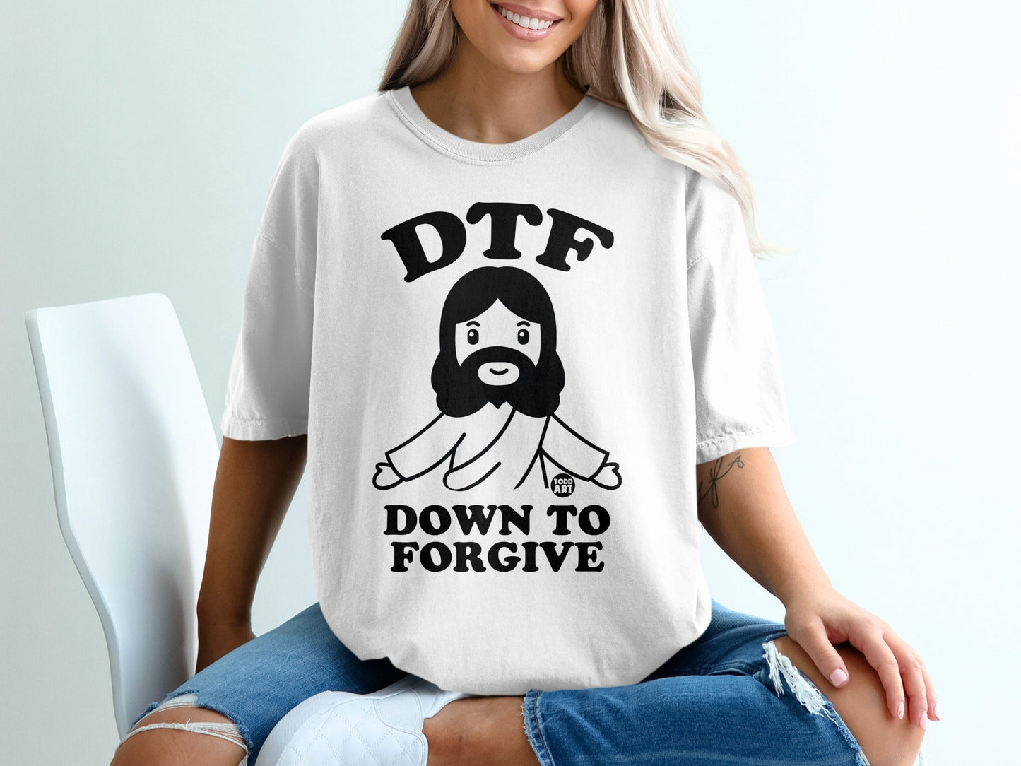 DTF Down to Forgive graphic t-shirt with cartoon Jesus.