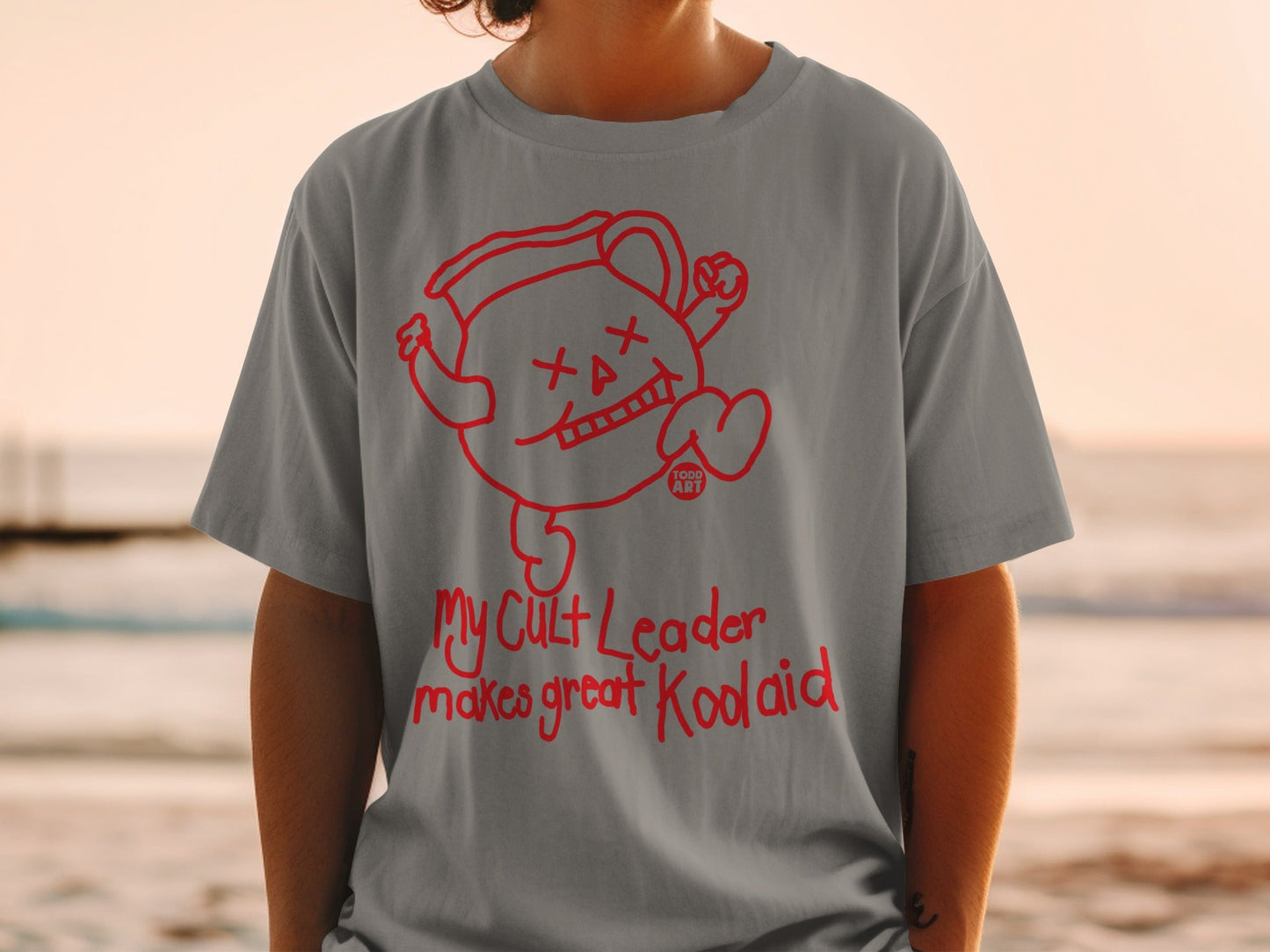 Gray t-shirt with Kool-Aid Man graphic and "My Cult Leader makes great Kool-Aid" text.