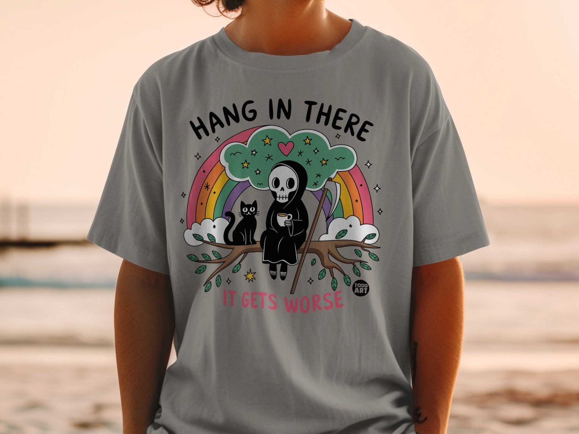 Grim reaper and black cat on a branch with "Hang in there, it gets worse" text.