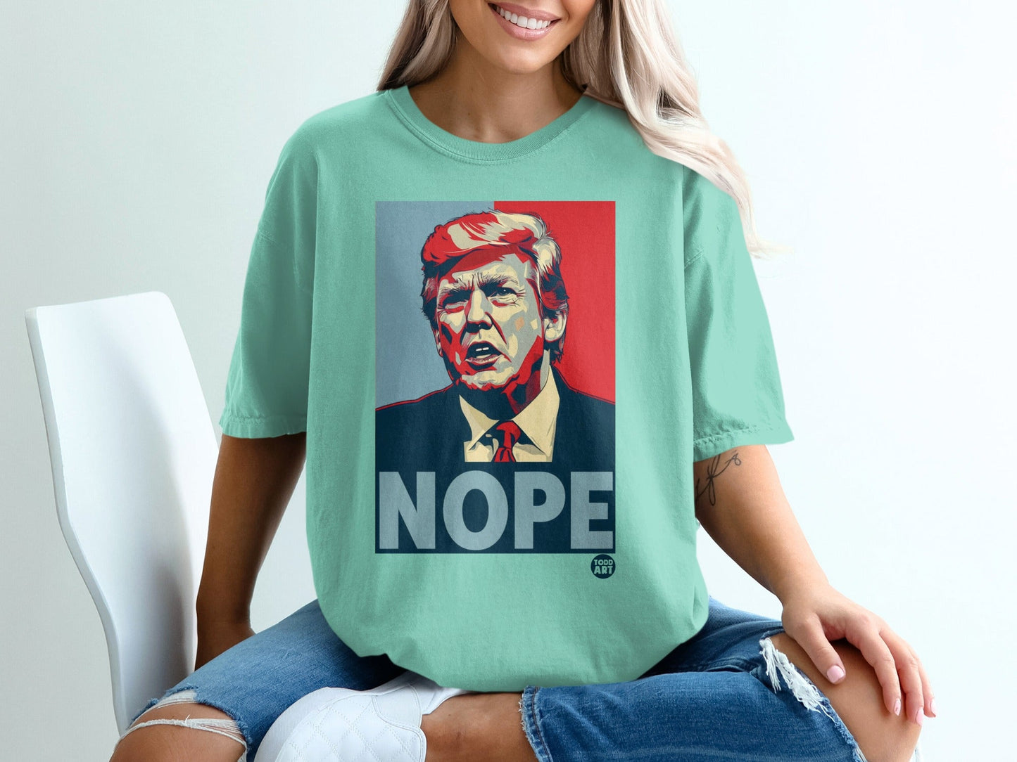 T-shirt featuring a graphic print of Donald Trump with "NOPE" in large text.