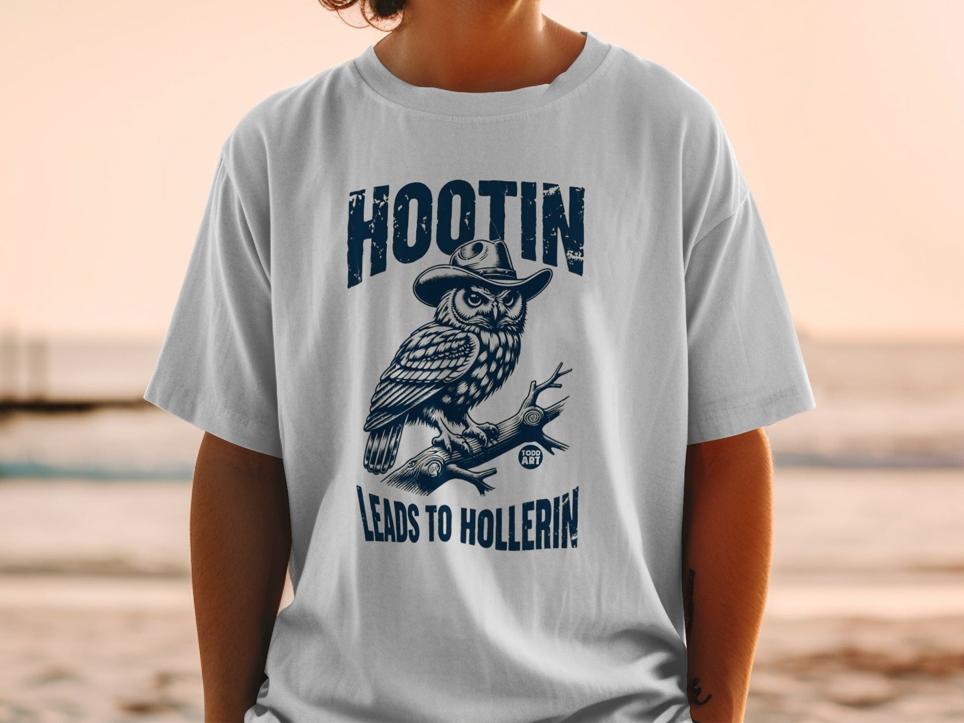 T-shirt with owl in hat, text "HOOTIN' LEADS TO HOLLERIN'".