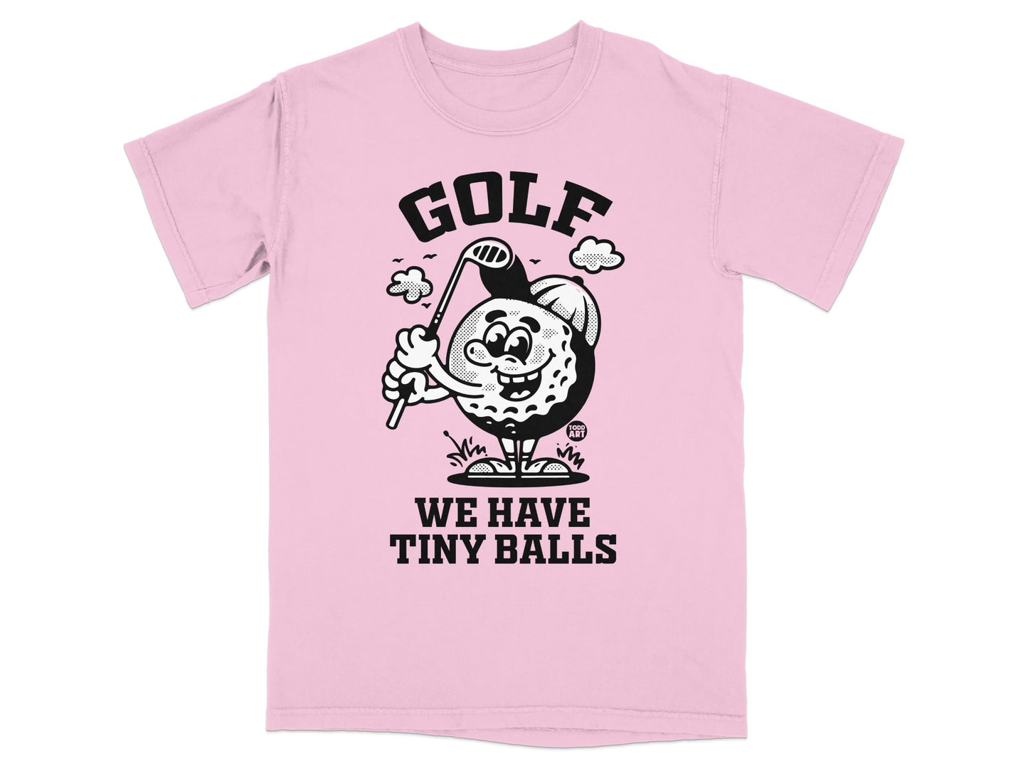 Pink t-shirt with cartoon golf ball character and text "GOLF WE HAVE TINY BALLS".