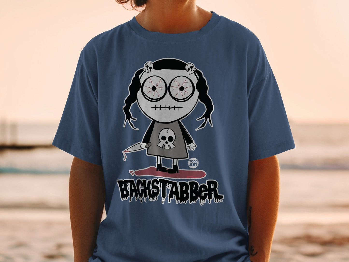 Backstabber Character Shirt with Creepy Doll Design