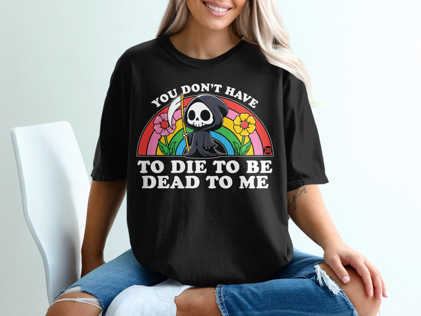 Black t-shirt with a cartoon grim reaper and rainbow graphic, text "You don't have to die to be me".