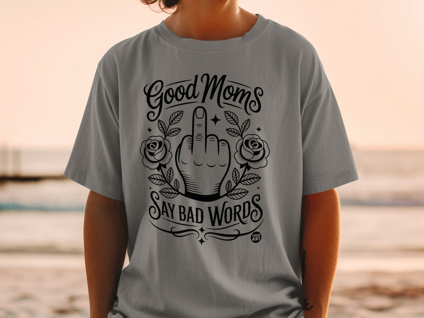 Gray t-shirt with "Good Moms Say Bad Words" and middle finger graphic.