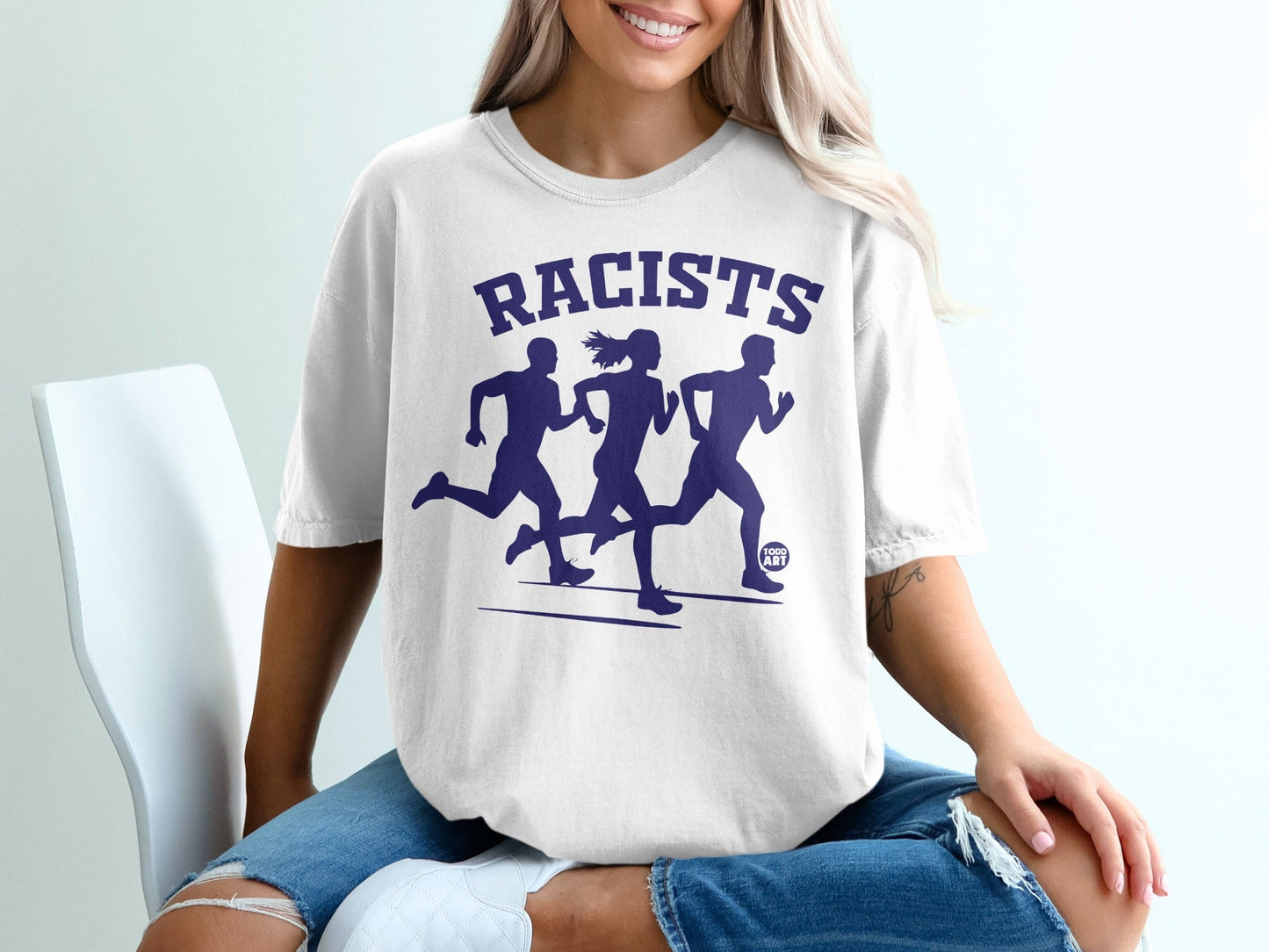 White t-shirt with "RACISTS" and three running figures in dark blue.