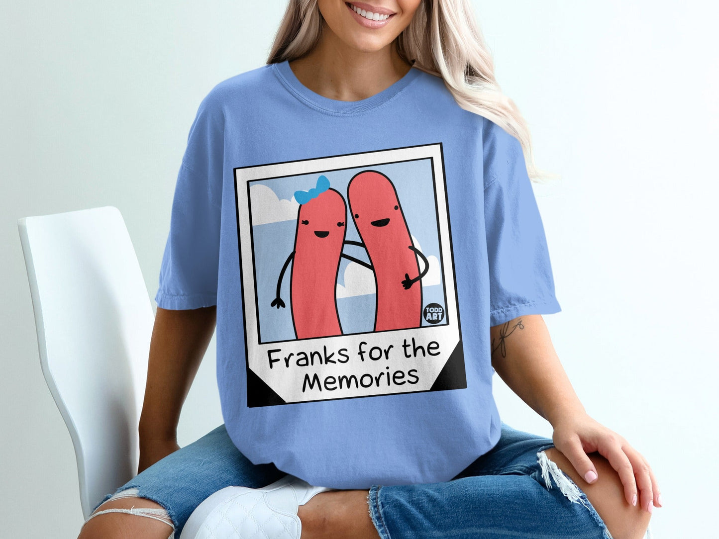 Two cartoon hot dogs in a picture frame, smiling, with "Franks for the Memories" text.