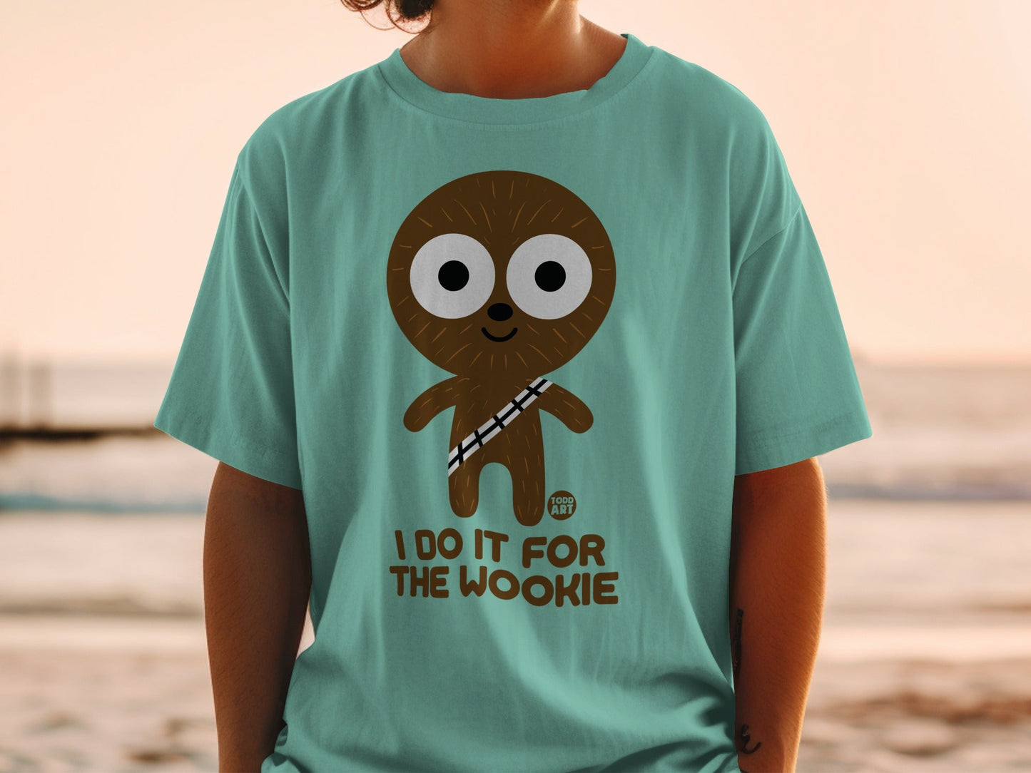 Teal t-shirt with cartoon Chewbacca character and text "I DO IT FOR THE WOOKIE".