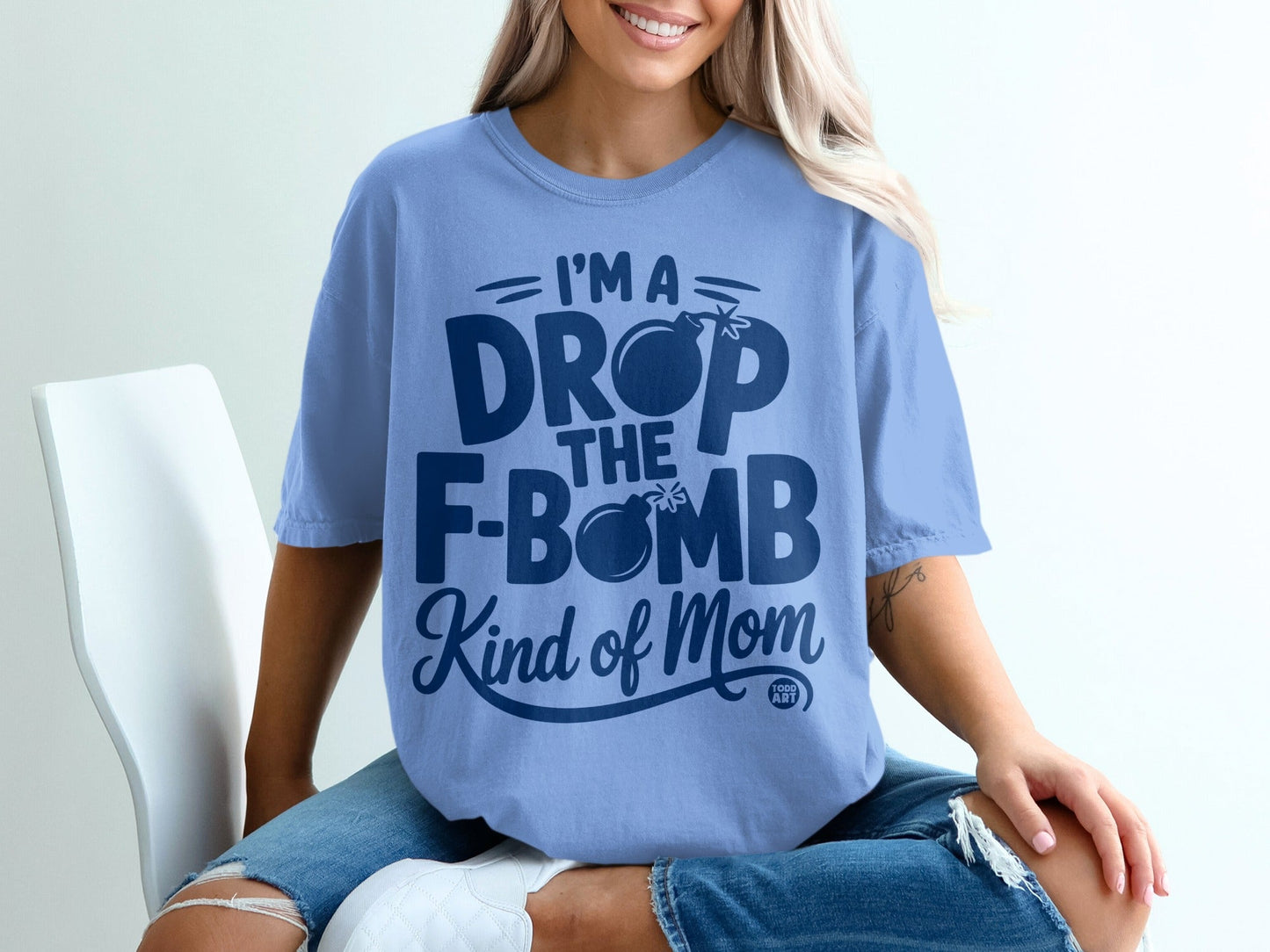 Light blue t-shirt with "I'm a drop the f-bomb kind of mom" text.