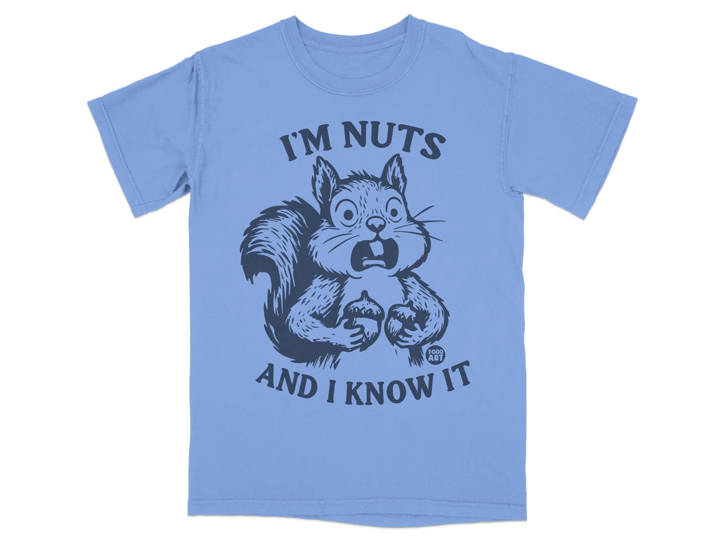 Light blue t-shirt with a startled squirrel holding acorns and text that reads "I'm nuts and I know it".