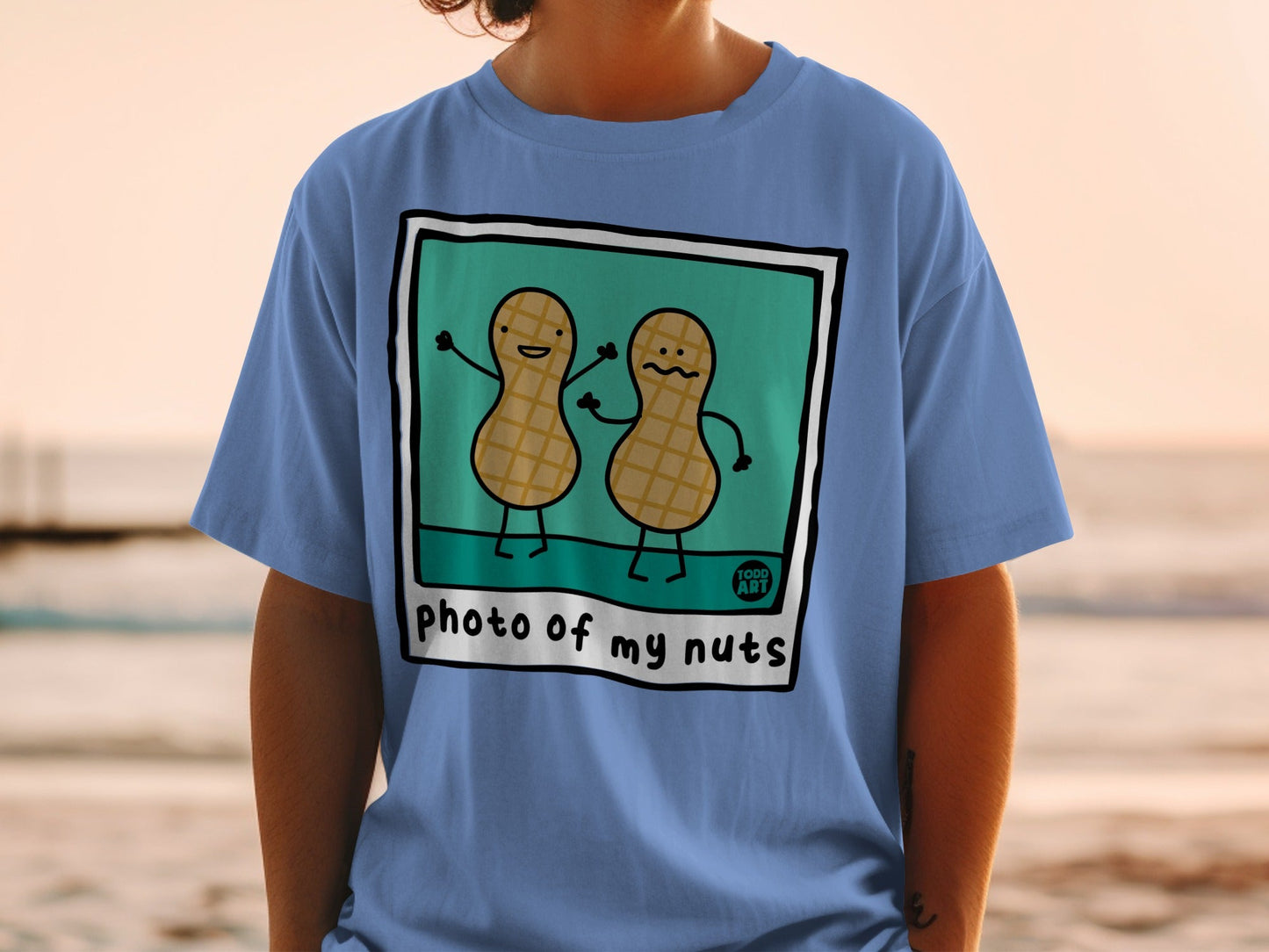 Blue t-shirt with a cartoon peanut couple and "photo of my nuts" text.
