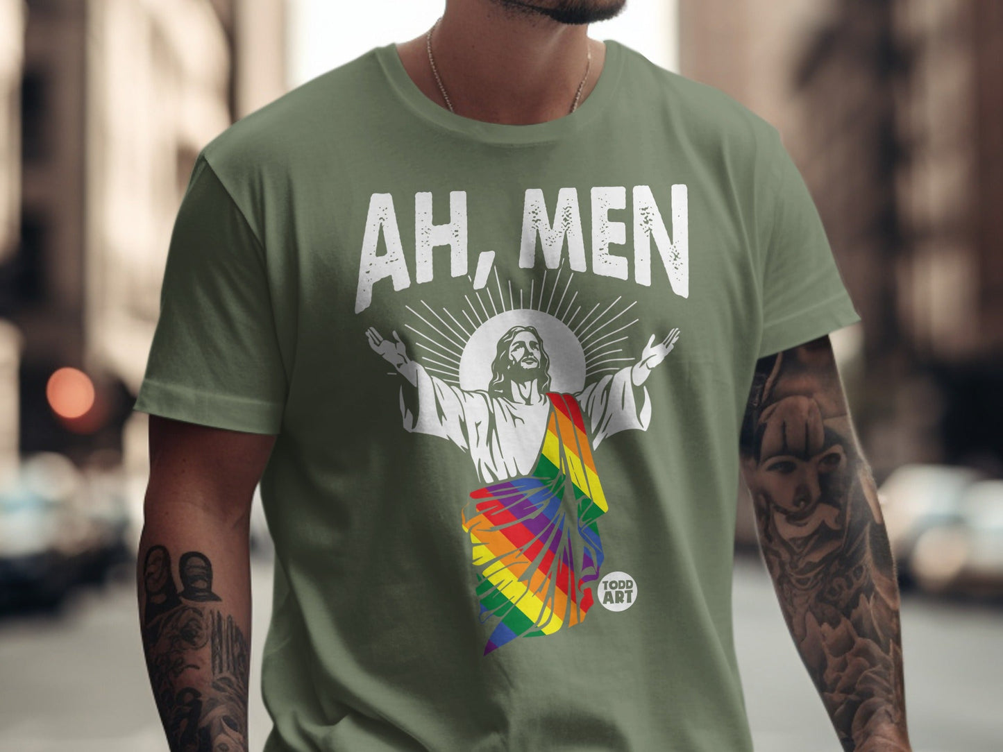 Green t-shirt with "AH, MEN" above Jesus in rainbow colors.