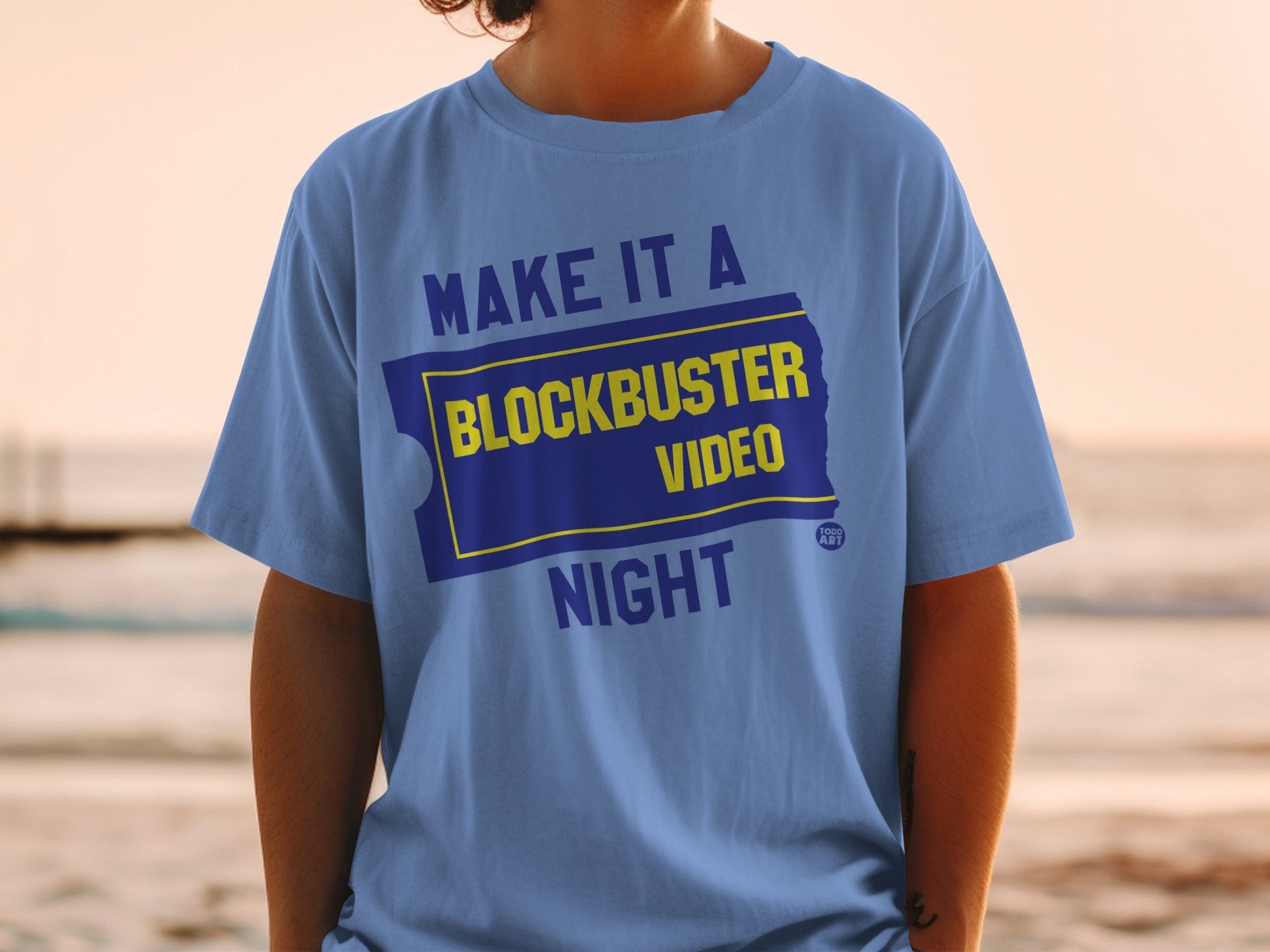 Blue t-shirt with "Make it a Blockbuster Night" text and logo.