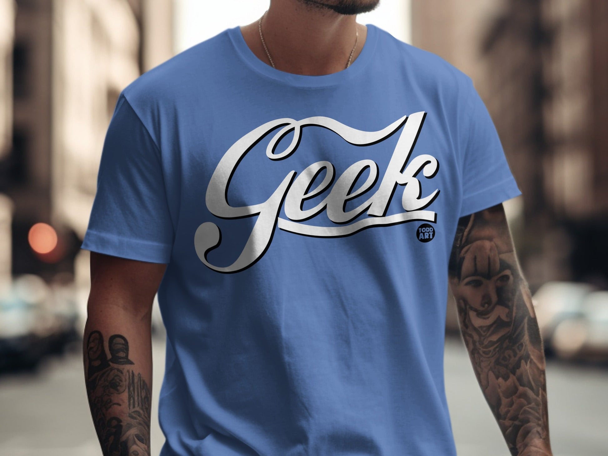 Blue t-shirt with "Geek Food Art" in white script on the chest.