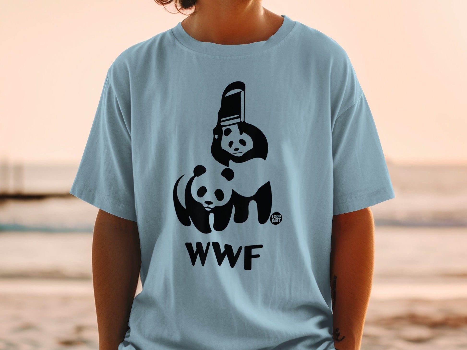 Light blue t-shirt with black WWF logo featuring pandas and camera lens.