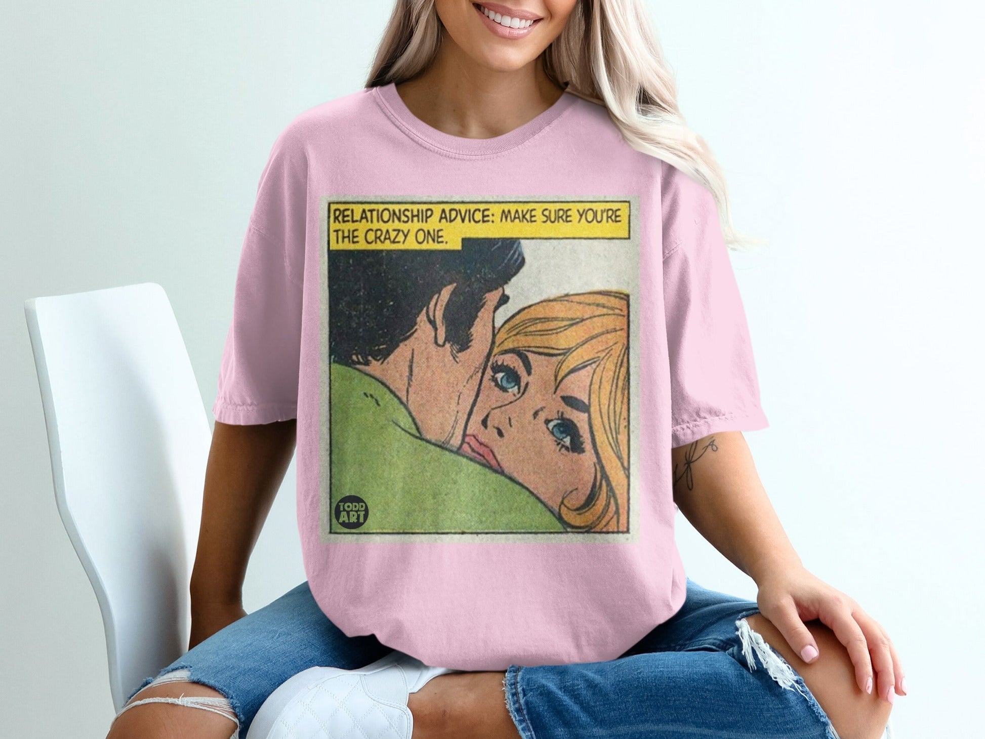 Pink t-shirt with comic art: "RELATIONSHIP ADVICE: MAKE SURE YOU'RE THE CRAZY ONE."