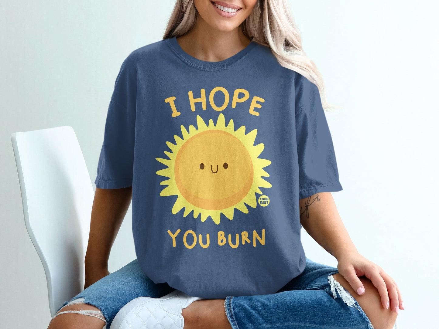 Navy t-shirt with a smiling sun graphic and "I HOPE YOU BURN" text.