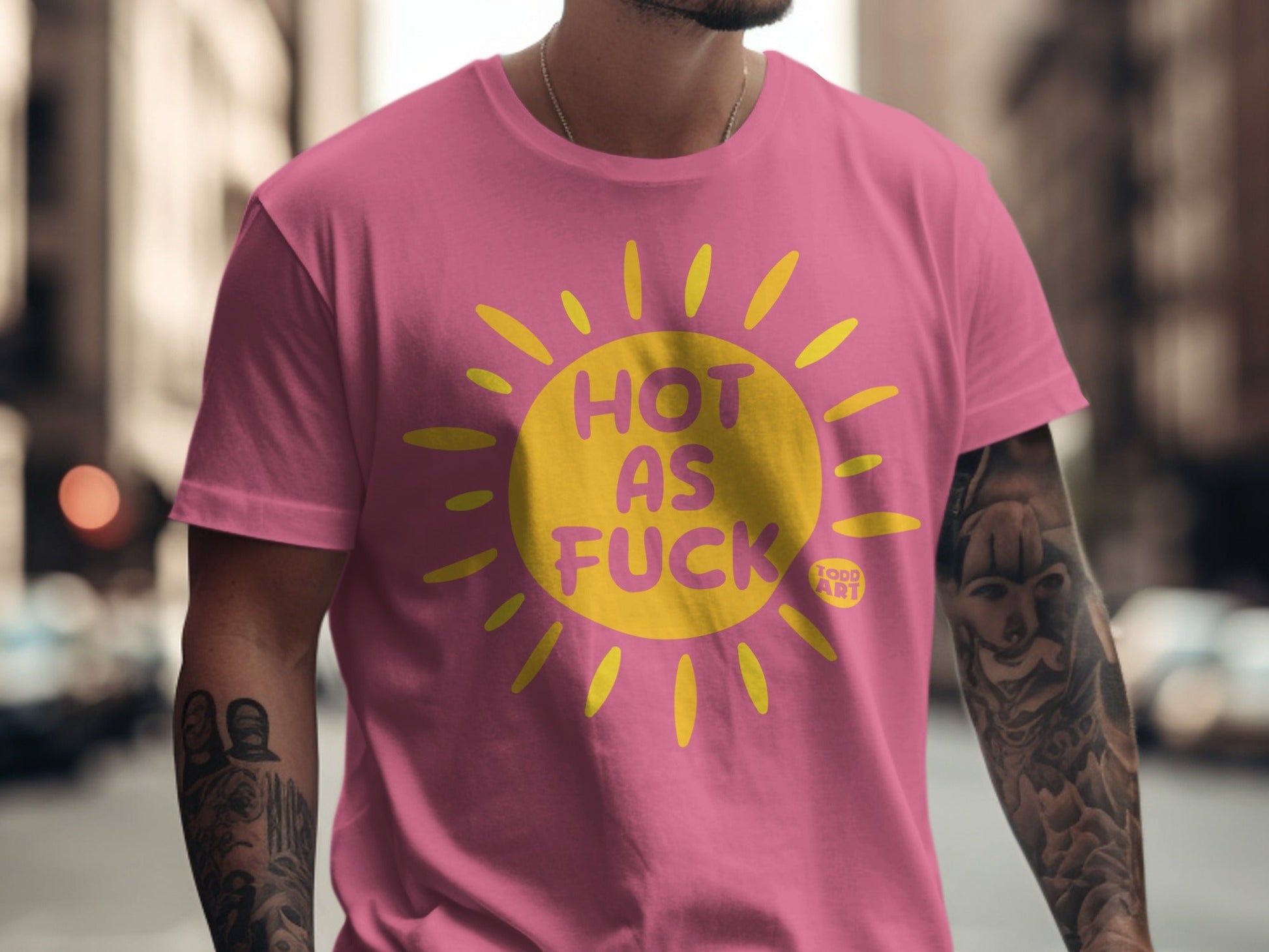 Pink t-shirt with yellow sun graphic and "HOT AS FUCK" text.